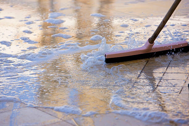 Person cleaning floor